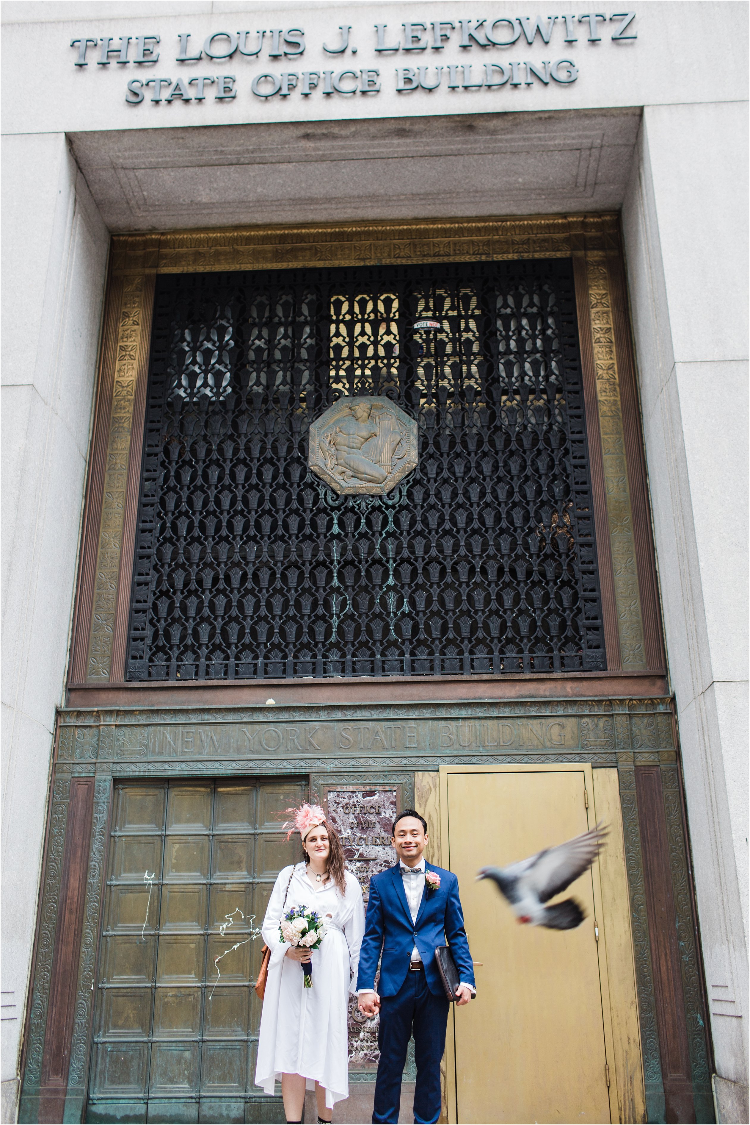 Bride and groom in front of NYC City Hall