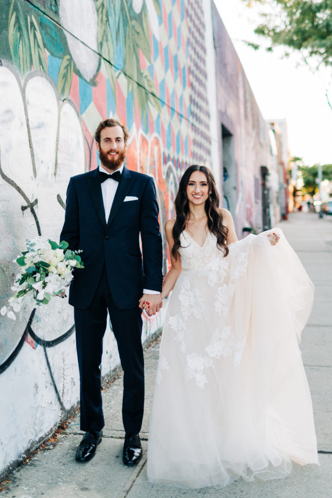 Wedding portrait in front of graffiti in Brooklyn